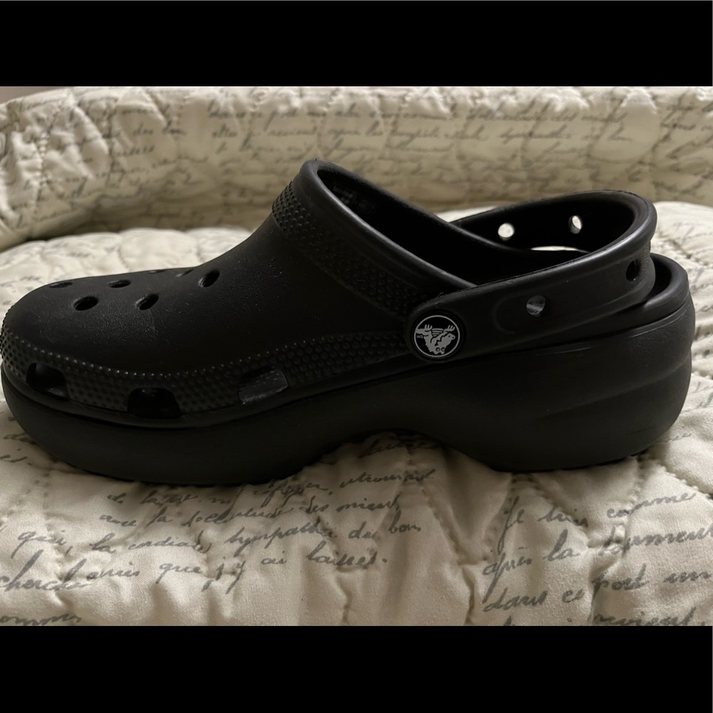 Size 6 black wedge crocs. Like new. Only worn a few times. Smoke free home.